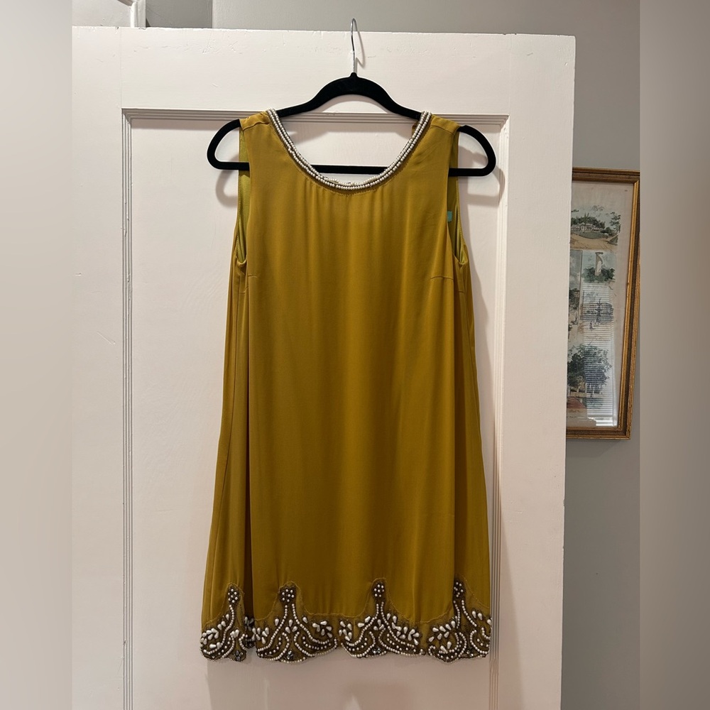 Elegant Mustard Sleeveless Dress with Beaded Hem